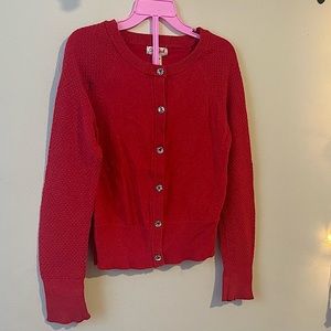 Girls red Cat & Jack cardigan. It’s glittery with sparkly buttons.
